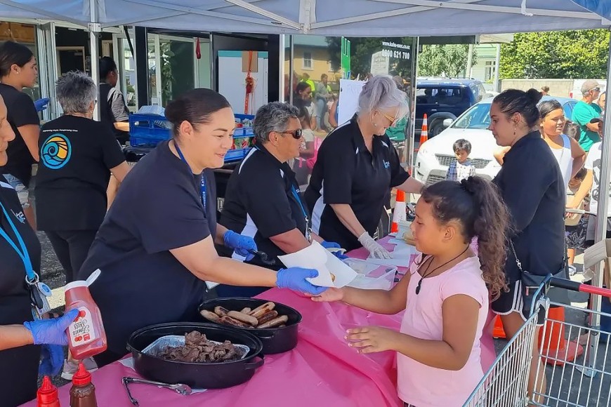 Volunteers hand out food in Wairoa, following Cyclone Gabrielle. Image: RNZ / Jonty Dine.